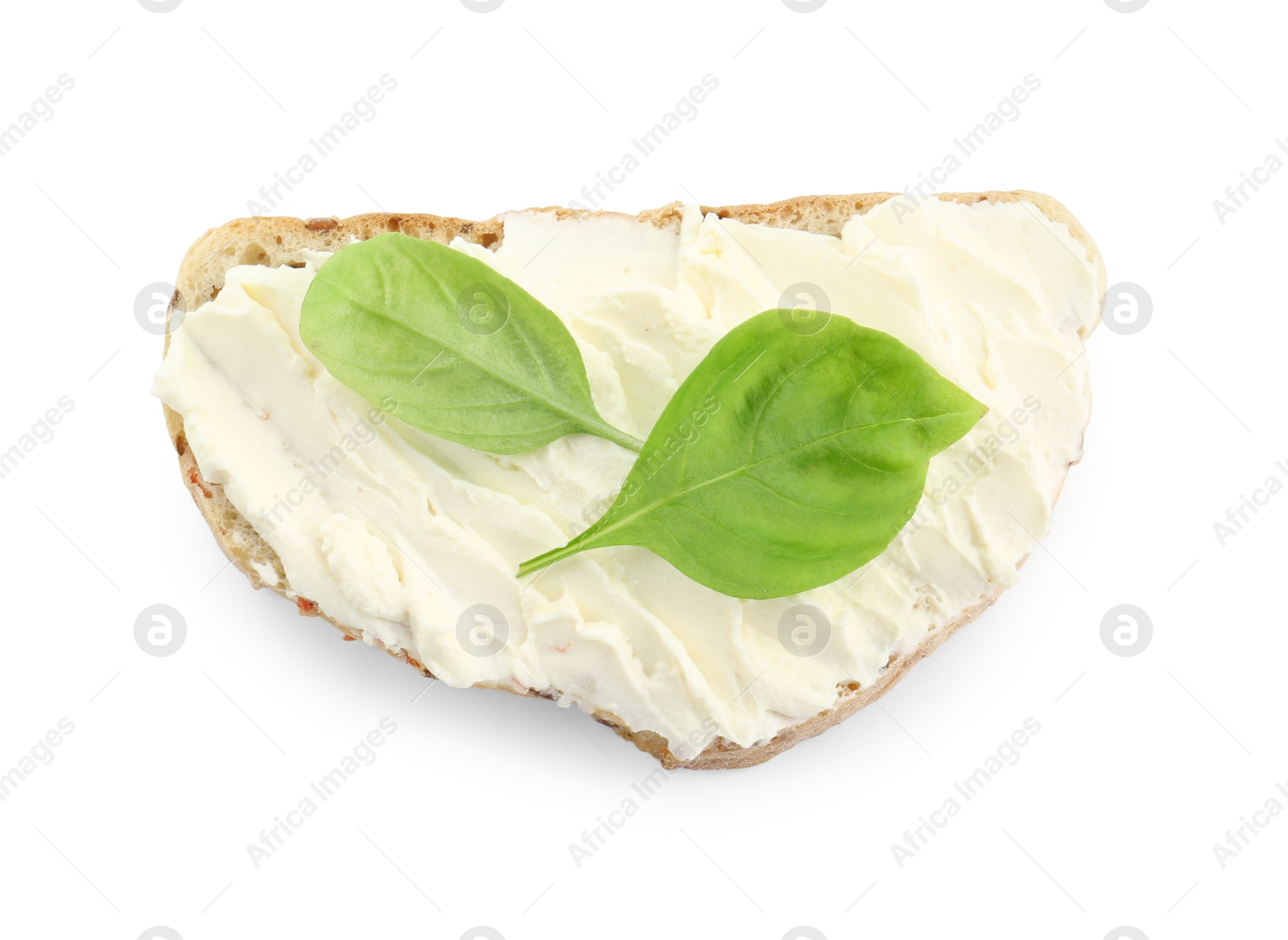 Photo of Piece of bread with cream cheese and basil leaves isolated on white, top view