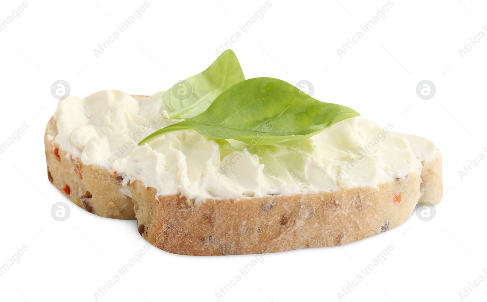 Photo of Piece of bread with cream cheese and basil leaves isolated on white