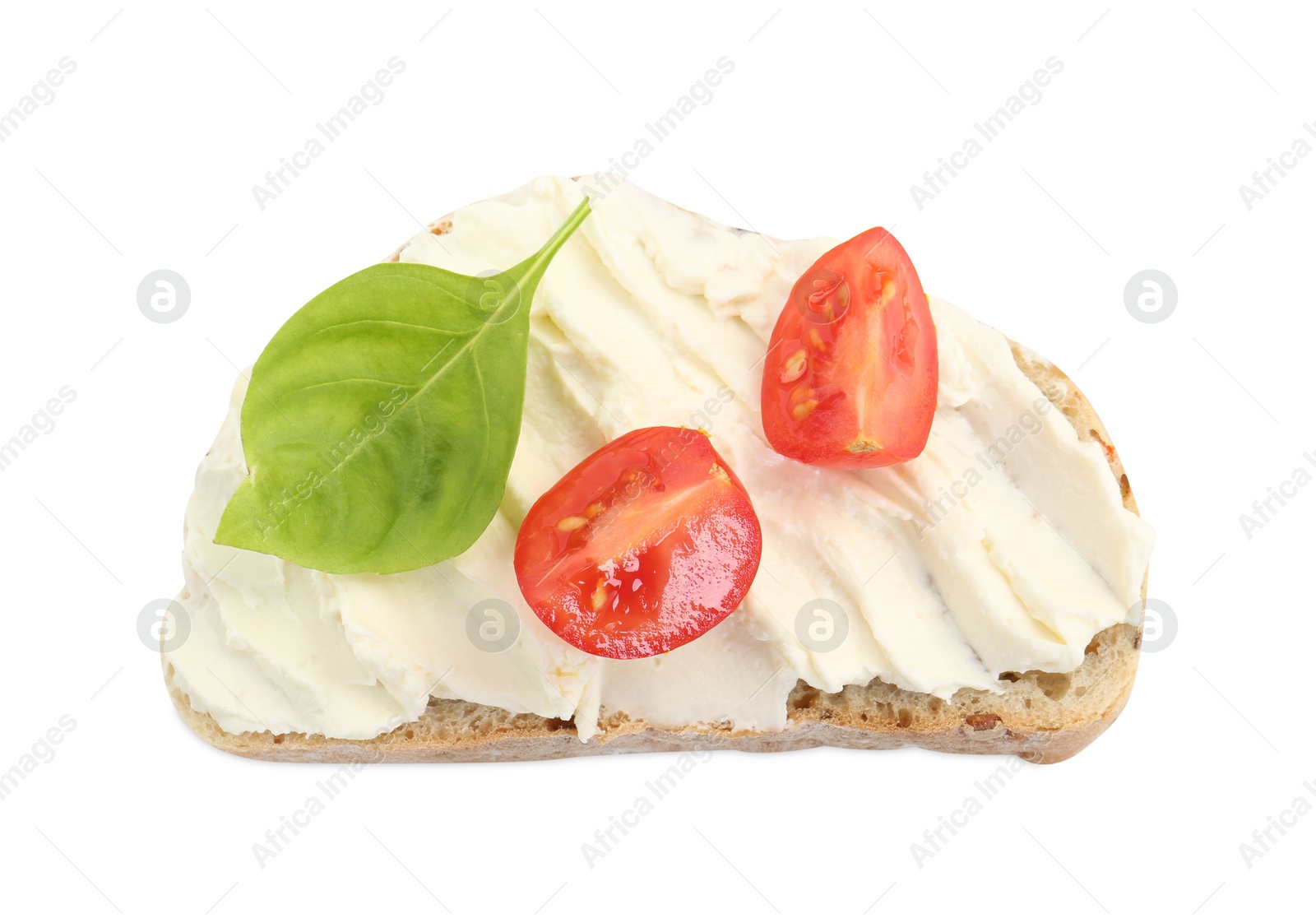 Photo of Piece of bread with cream cheese, basil leaf and tomato isolated on white, top view