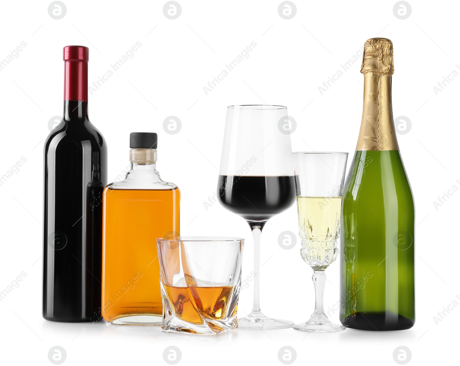 Photo of Bottles and glasses with different alcoholic drinks isolated on white