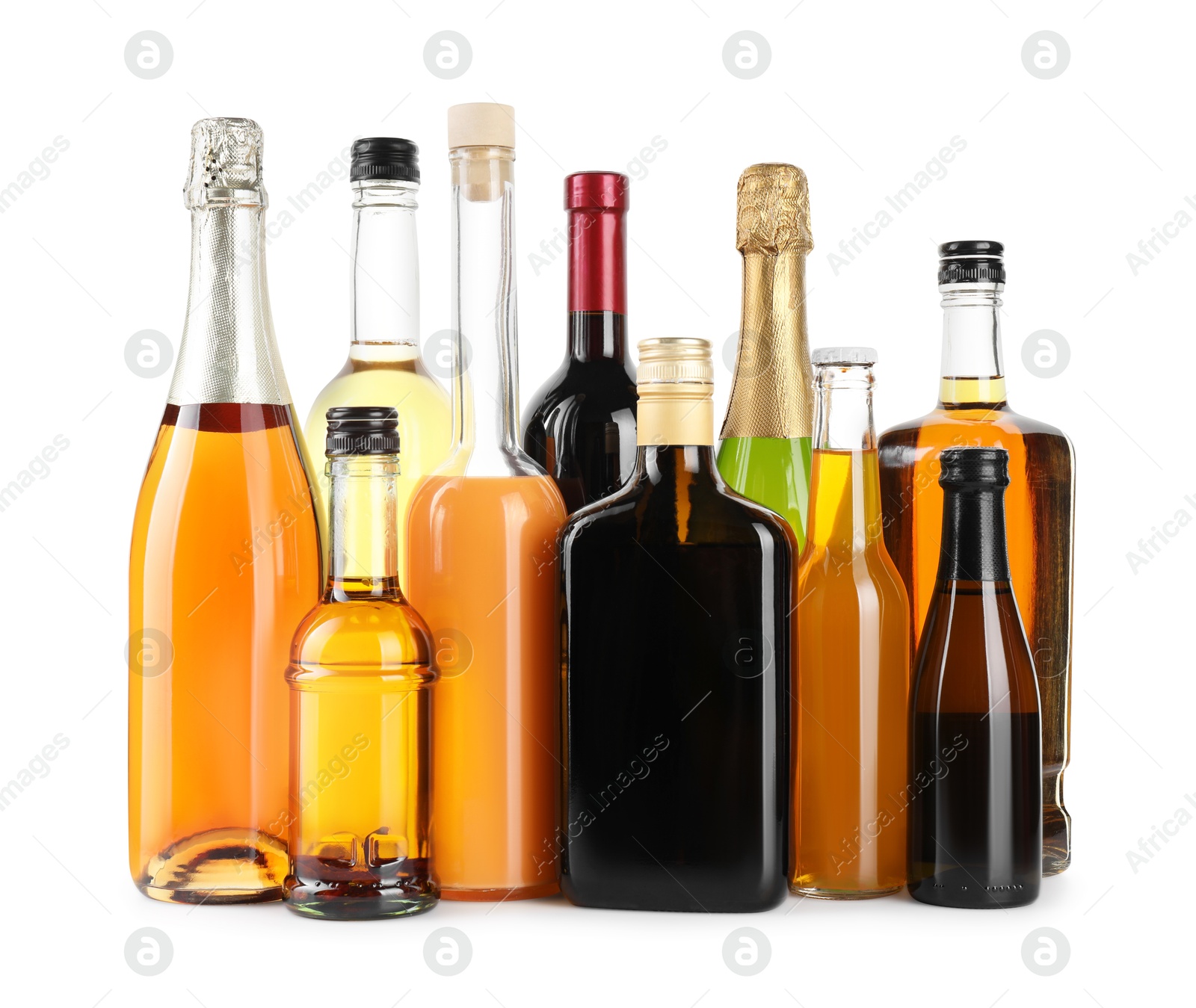 Photo of Bottles of different alcoholic drinks isolated on white