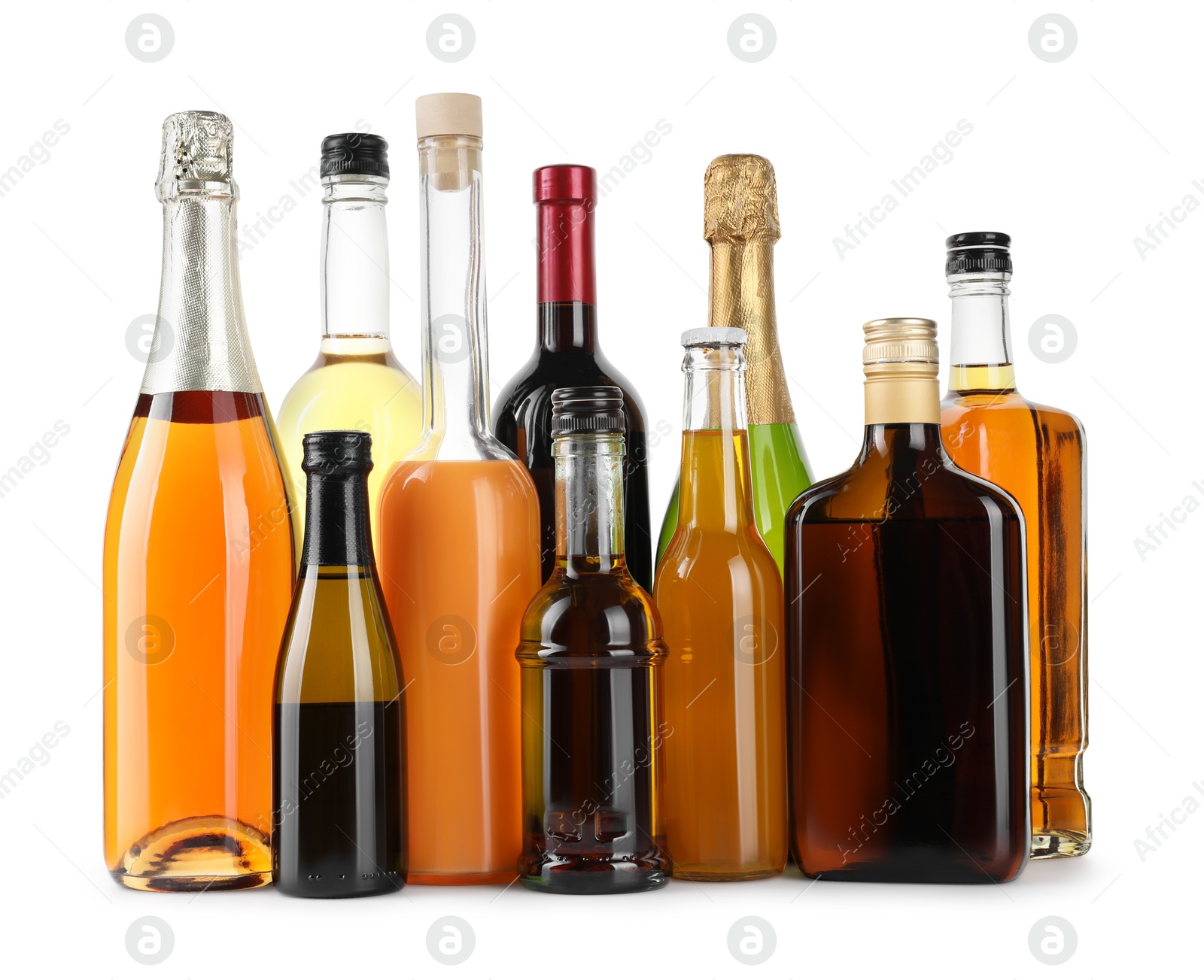 Photo of Bottles of different alcoholic drinks isolated on white