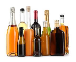 Bottles of different alcoholic drinks isolated on white