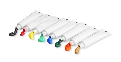 Photo of Tubes with colorful paints isolated on white