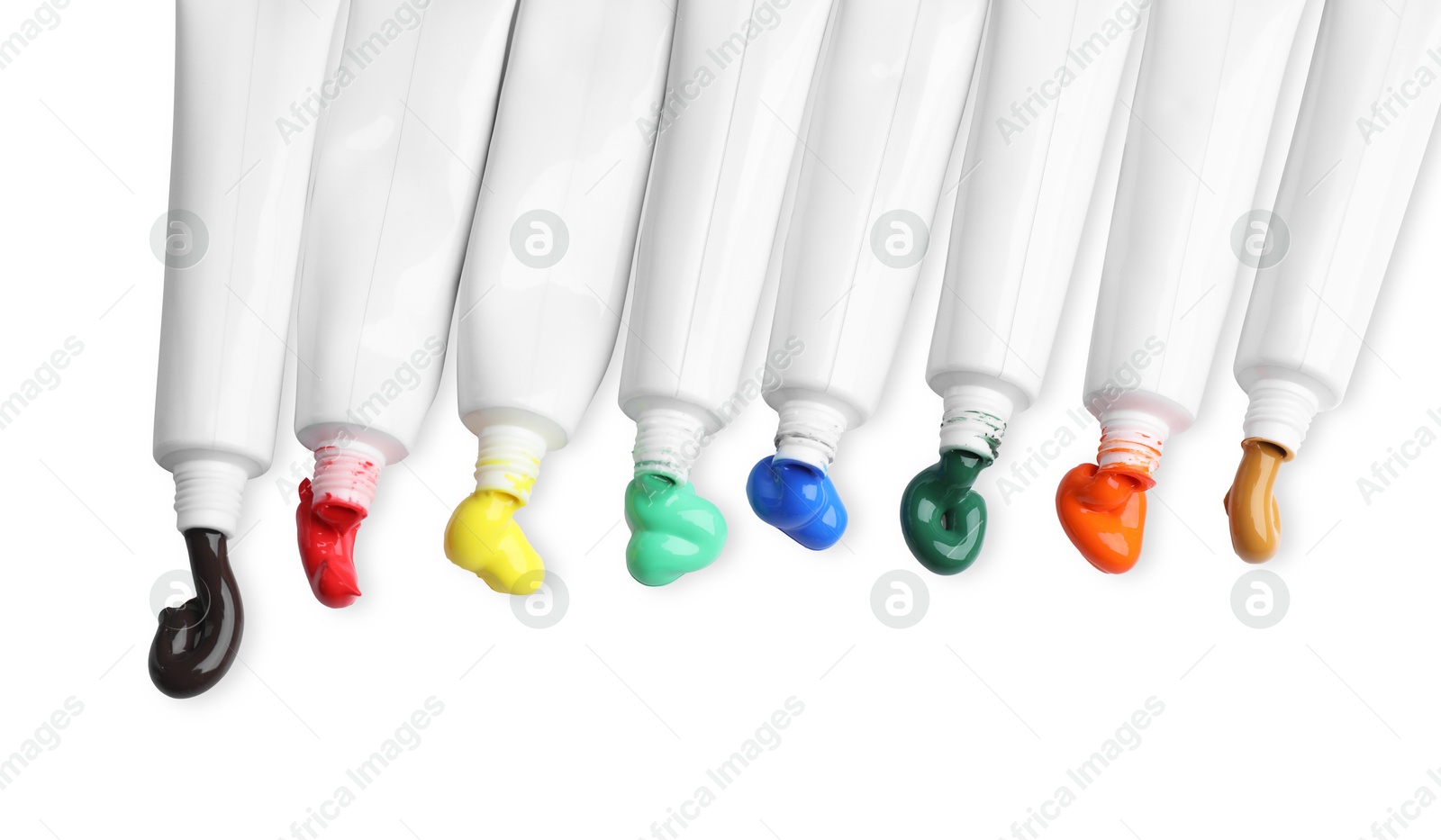 Photo of Tubes with colorful paints isolated on white, top view