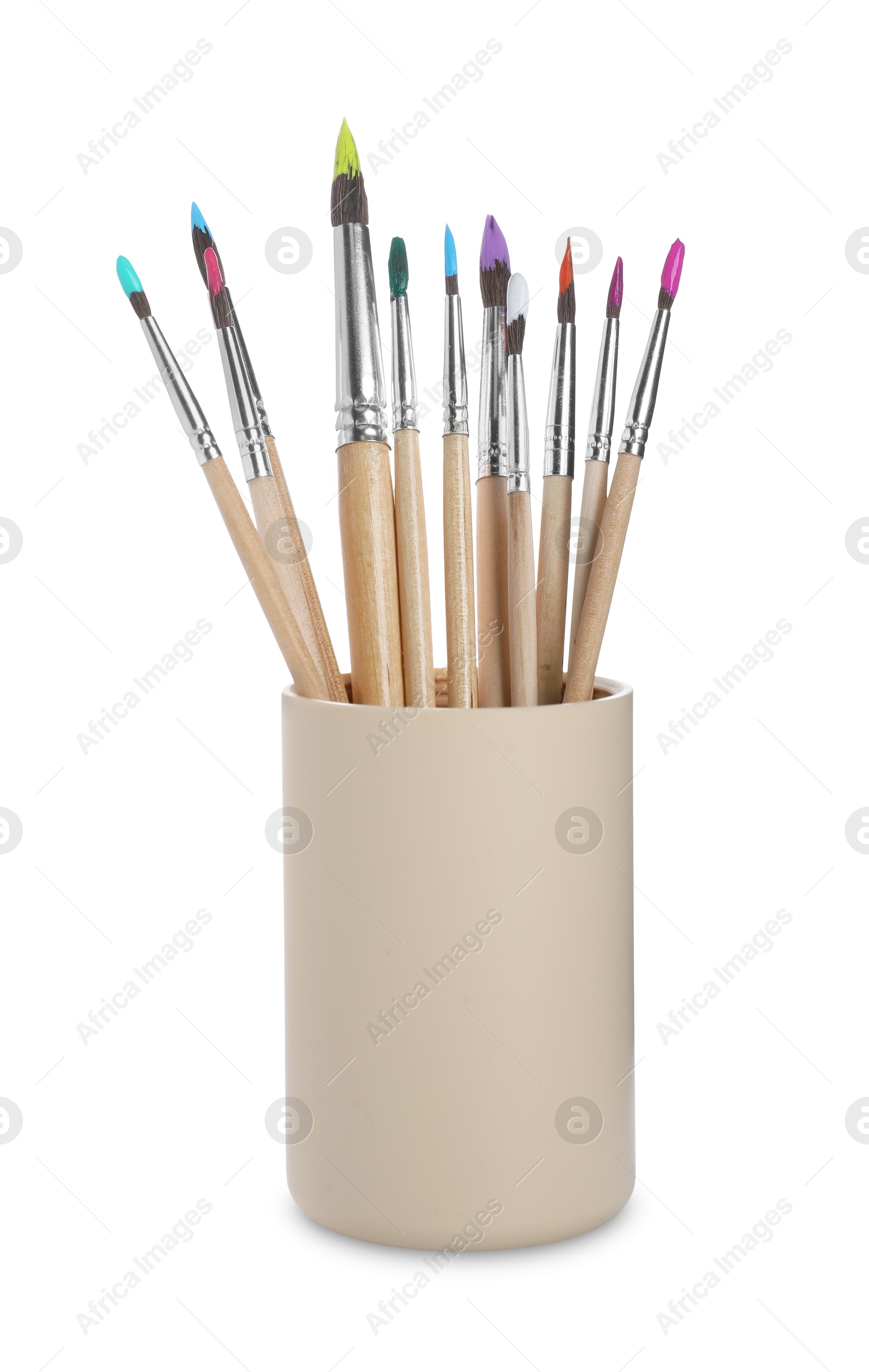 Photo of Wooden brushes with colorful paints in holder isolated on white