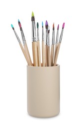 Photo of Wooden brushes with colorful paints in holder isolated on white