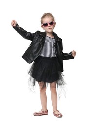 Photo of Cute little girl in sunglasses dancing on white background