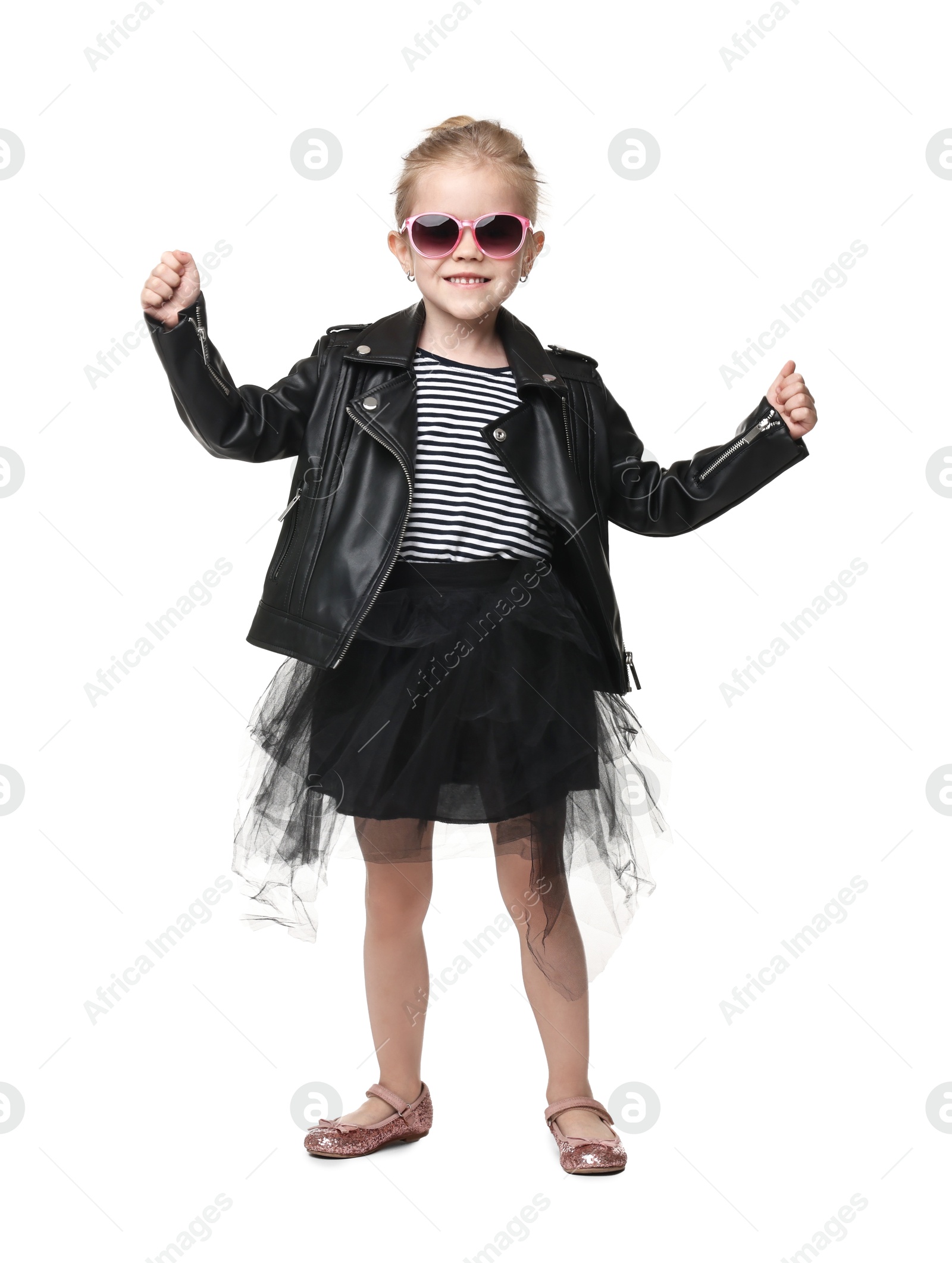 Photo of Cute little girl in sunglasses dancing on white background