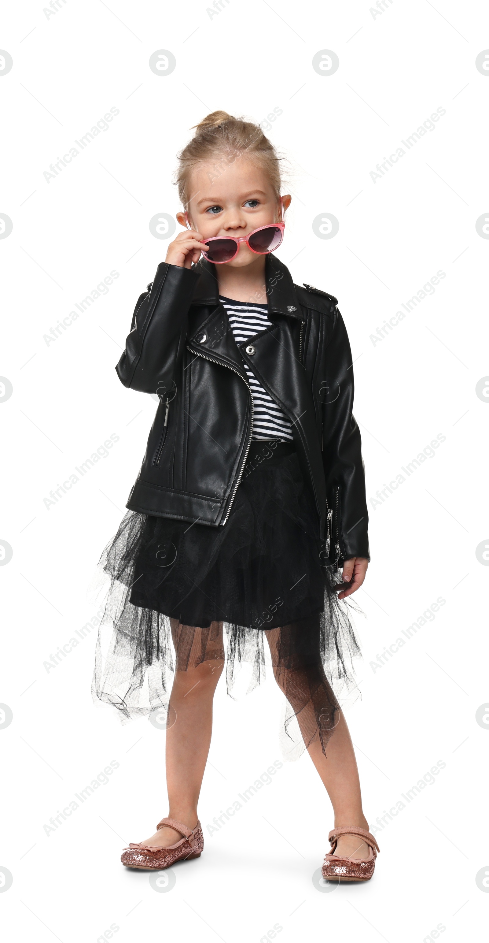 Photo of Cute little girl with sunglasses dancing on white background