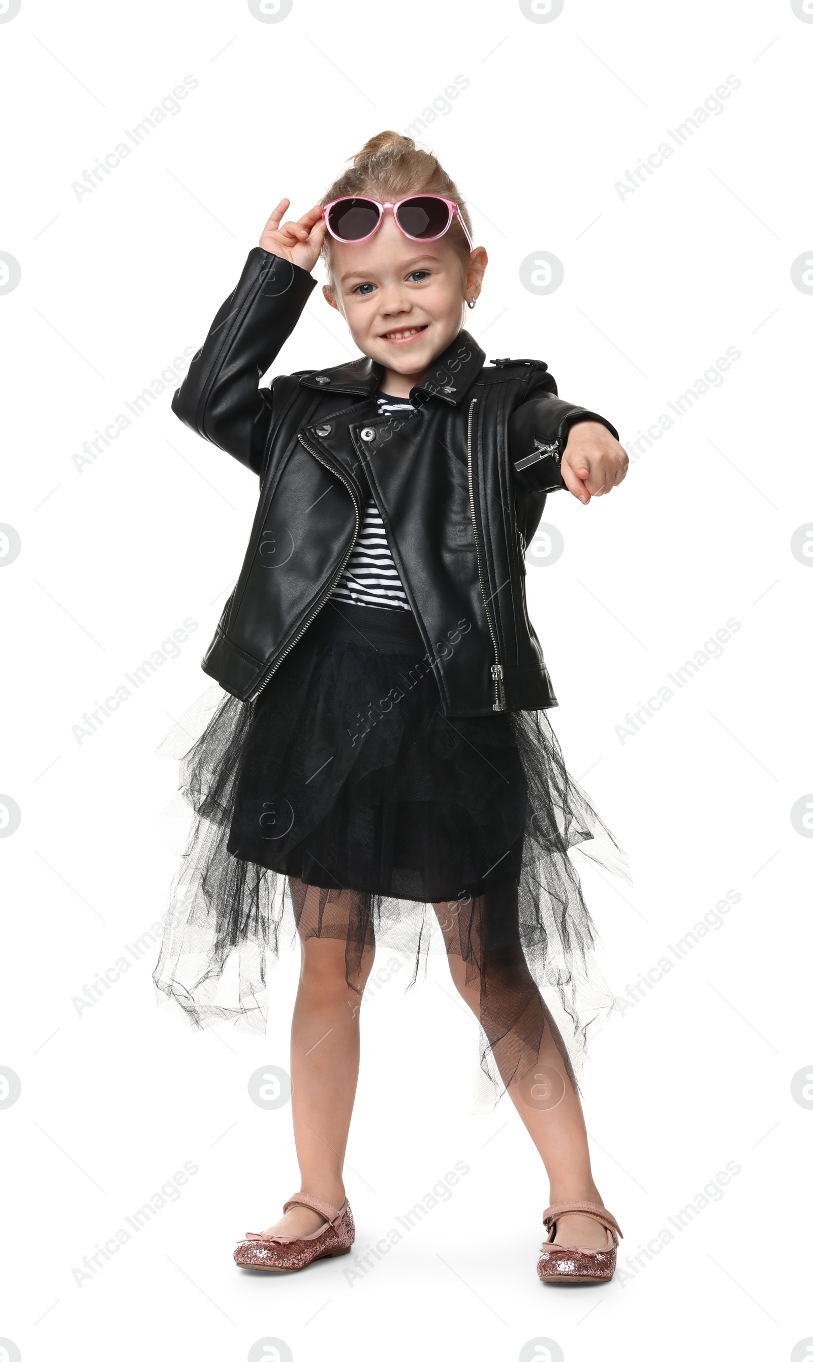 Photo of Cute little girl with sunglasses dancing on white background