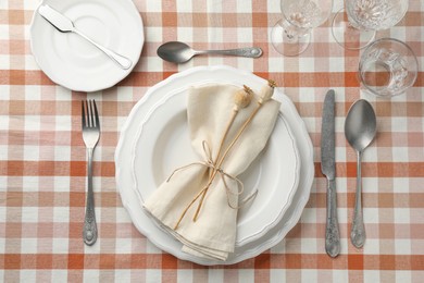 Stylish setting with cutlery and plates on table, flat lay