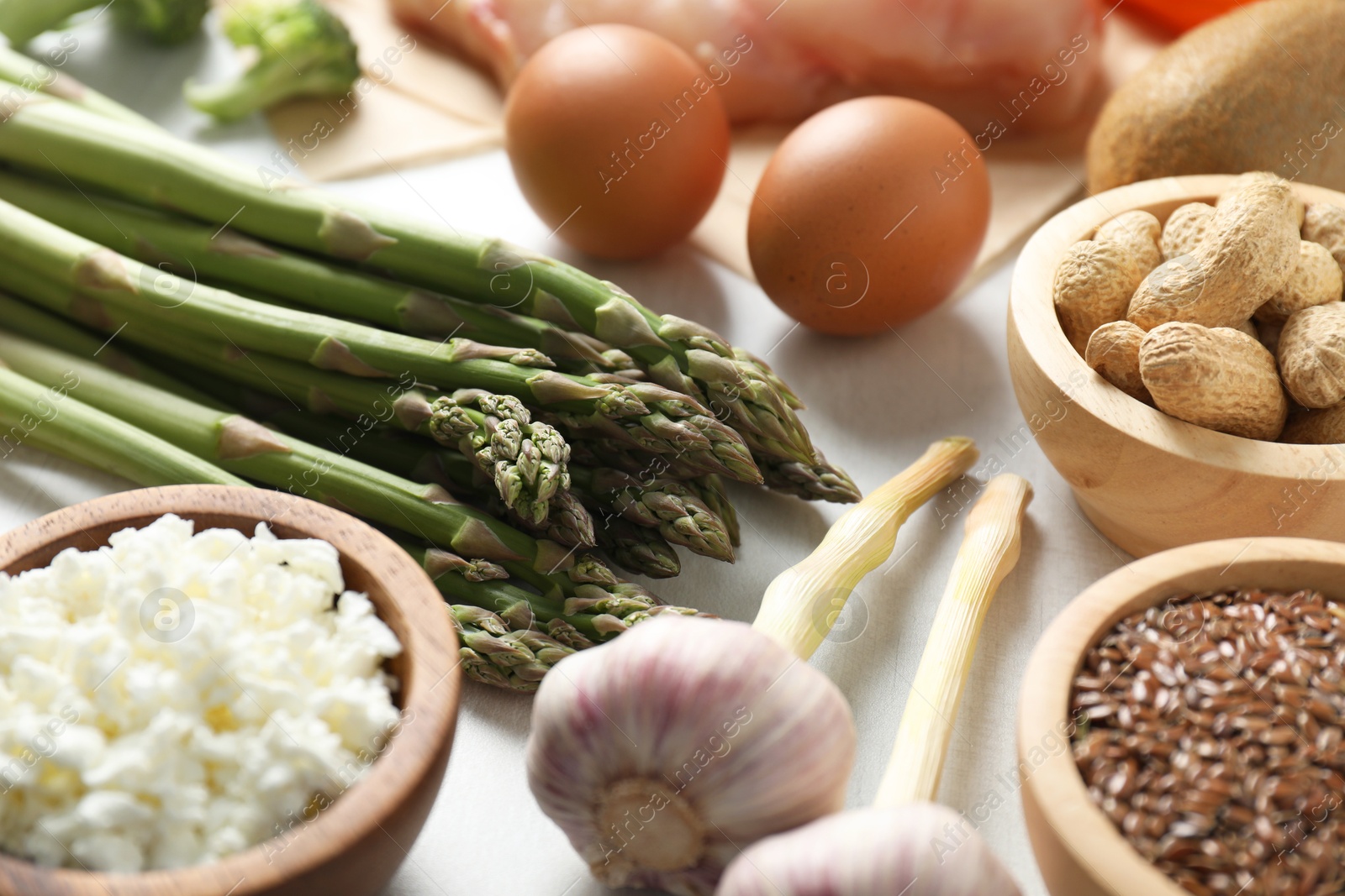 Photo of Many different healthy food on white table, closeup