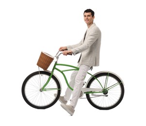 Photo of Smiling man riding bicycle with basket on white background