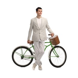 Smiling man with bicycle and basket isolated on white