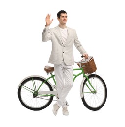 Photo of Smiling man with bicycle and basket isolated on white