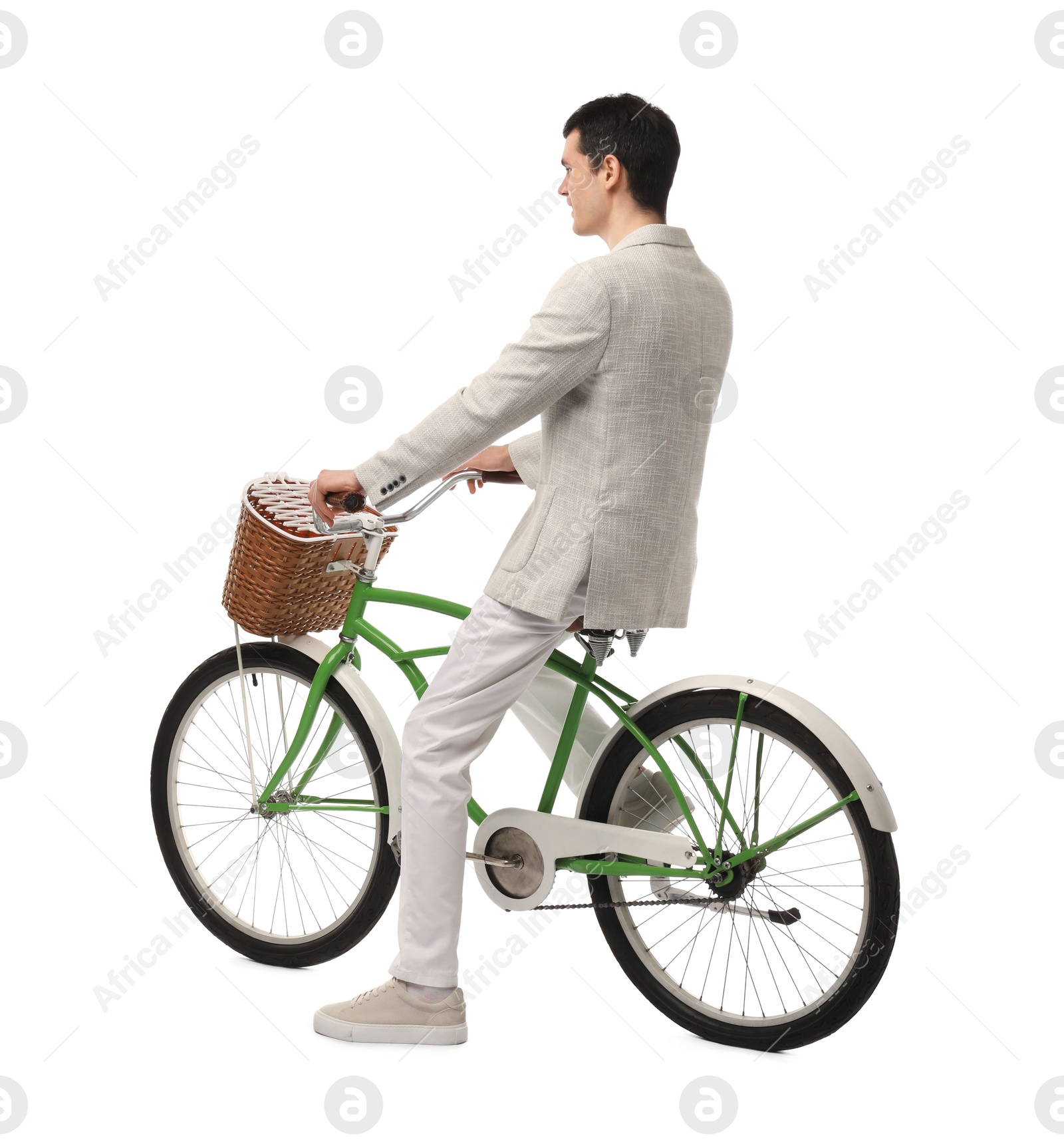 Photo of Man riding bicycle with basket isolated on white