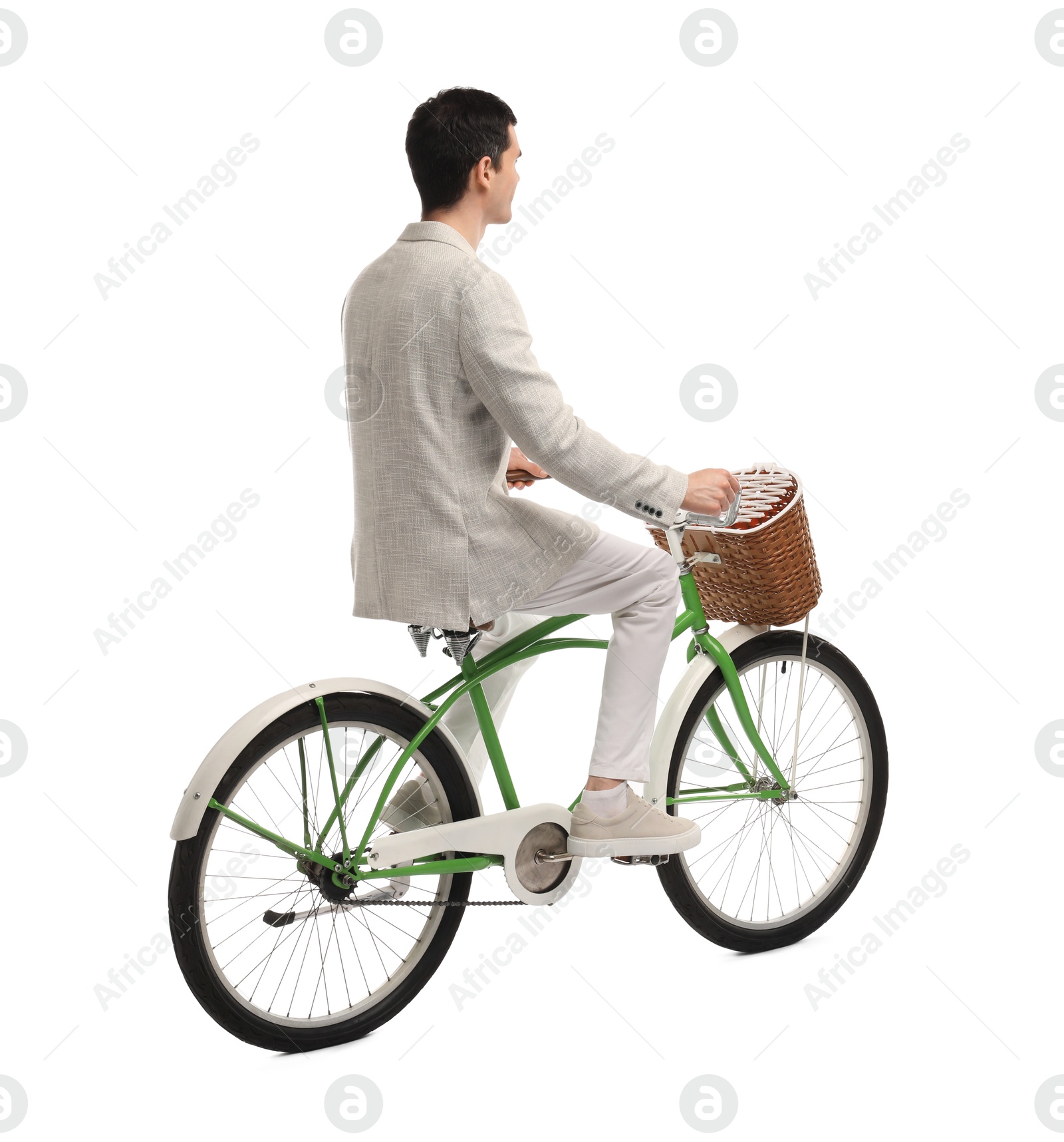 Photo of Man riding bicycle with basket isolated on white