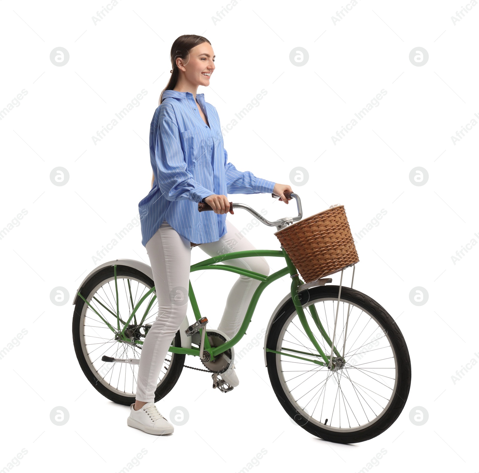 Photo of Smiling woman on bicycle with basket against white background