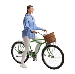 Photo of Smiling woman on bicycle with basket against white background