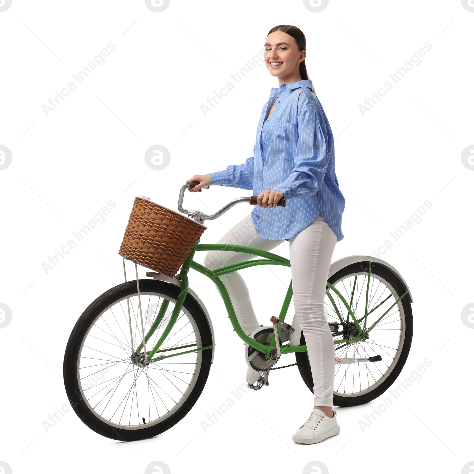 Photo of Smiling woman on bicycle with basket against white background