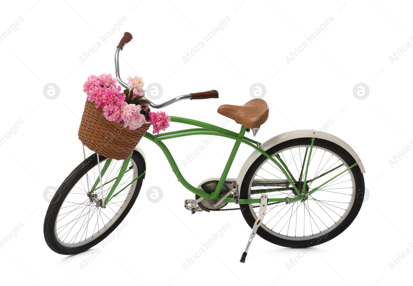 Photo of Bicycle with basket of pink peony flowers isolated on white