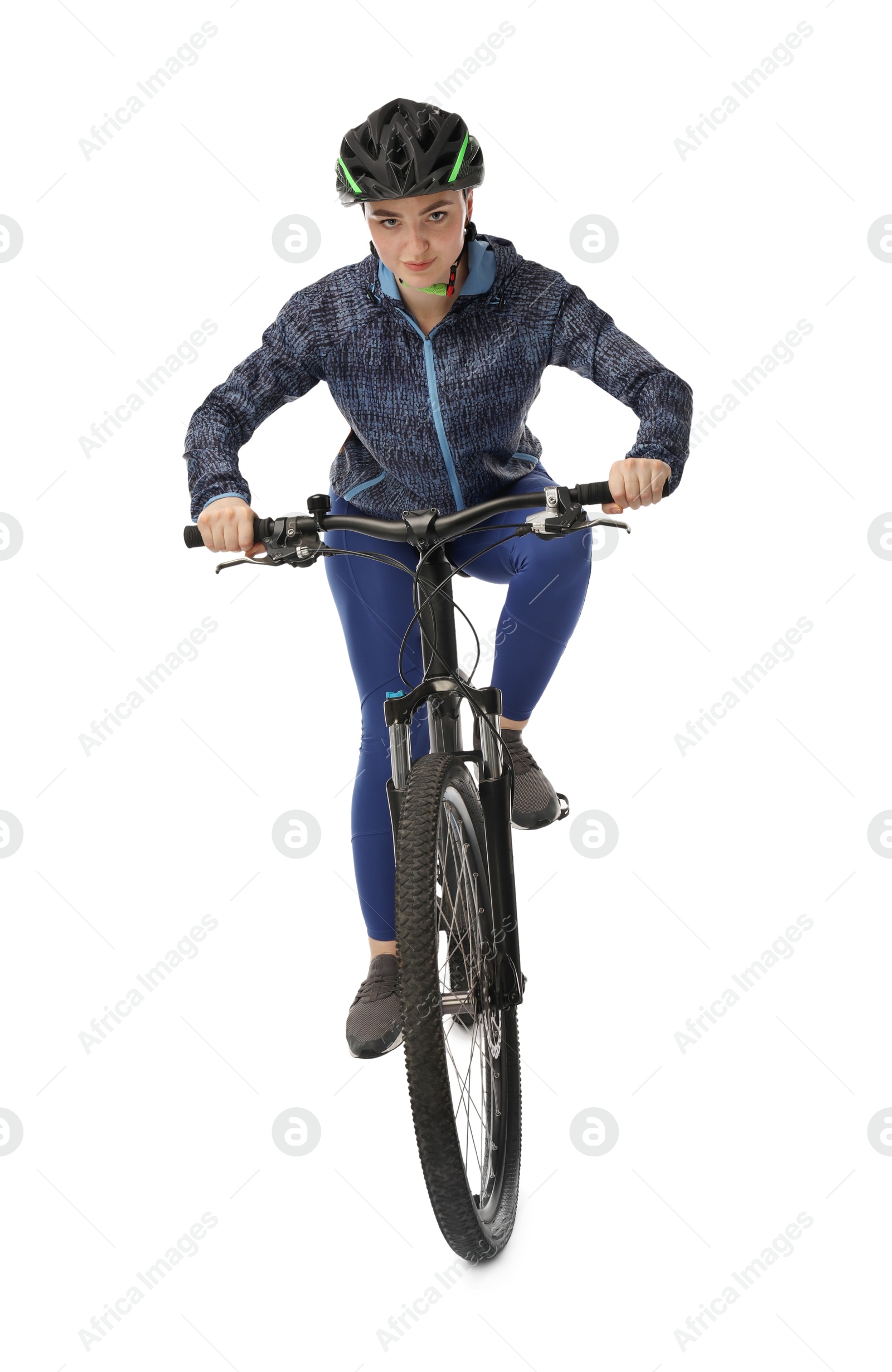 Photo of Beautiful young woman in helmet riding bicycle on white background