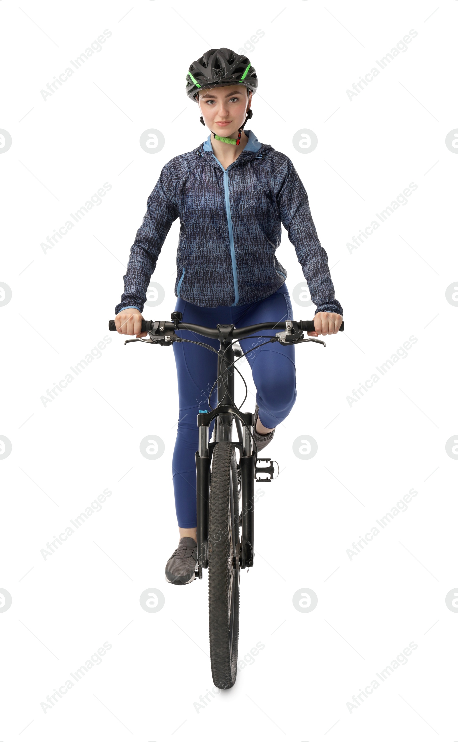 Photo of Beautiful young woman in helmet riding bicycle on white background