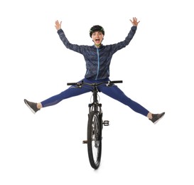 Emotional woman in helmet having fun while riding bicycle on white background