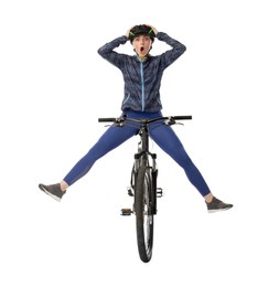 Photo of Emotional woman in helmet having fun while riding bicycle on white background