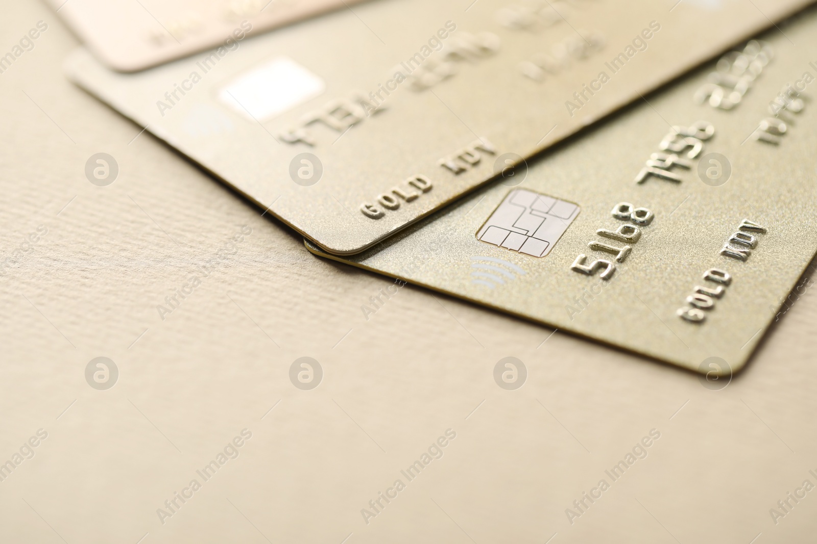 Photo of Different credit cards on table, closeup view. Space for text