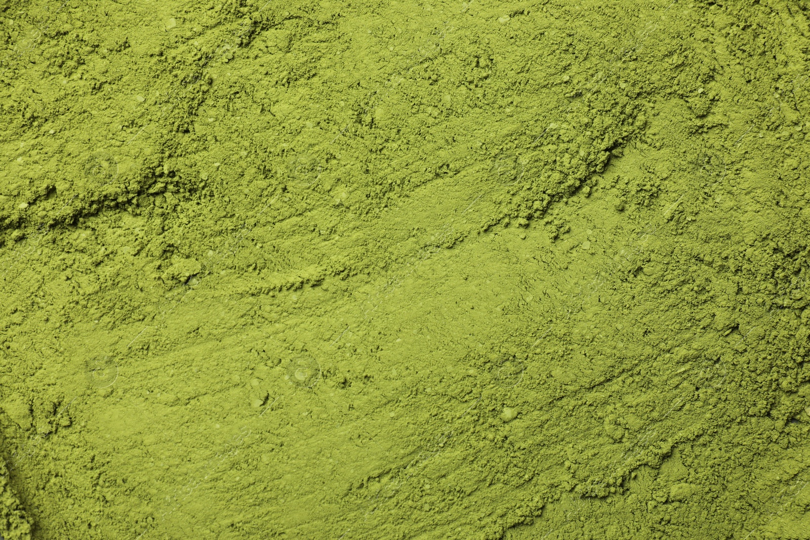 Photo of Green matcha powder as background, top view