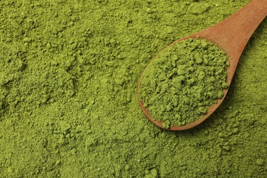 Photo of Spoon and green matcha powder, top view