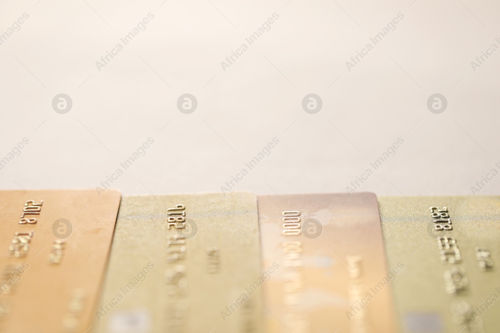 Photo of Many credit cards on gray background, closeup. Space for text