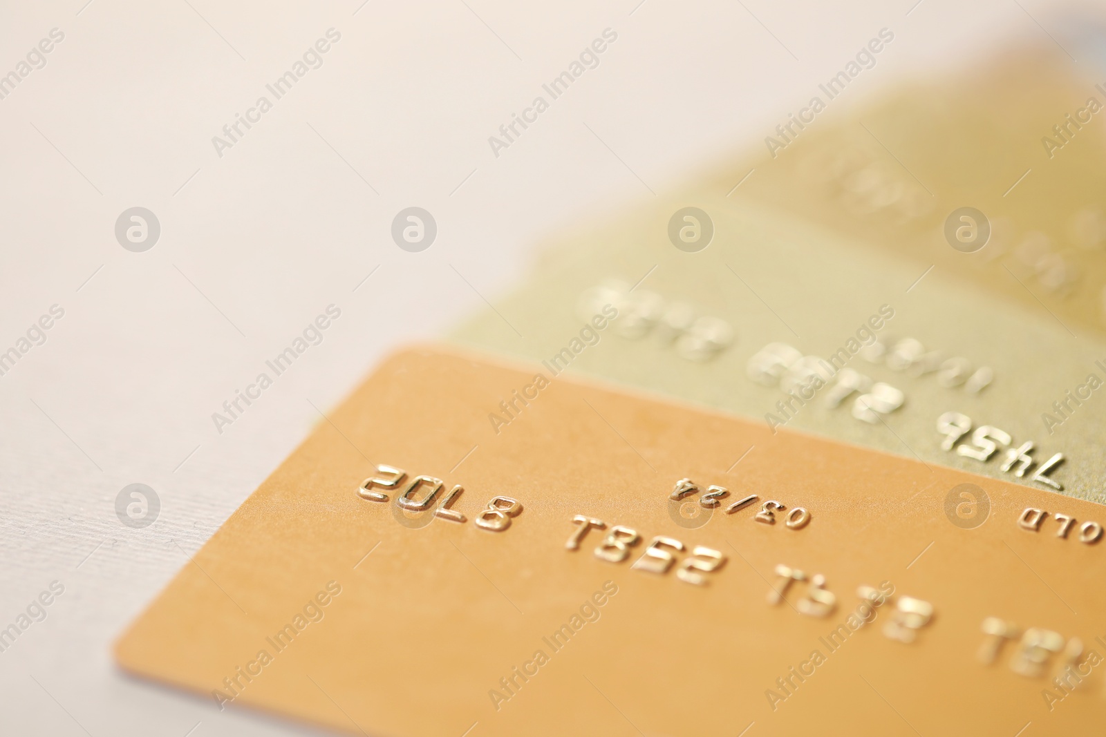 Photo of Many credit cards on gray background, closeup