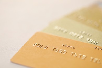 Many credit cards on gray background, closeup