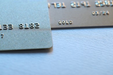 Photo of Two credit cards on light background, closeup