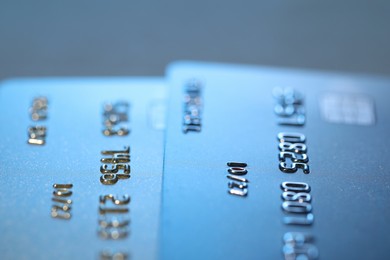 Credit cards on light blue background, macro view