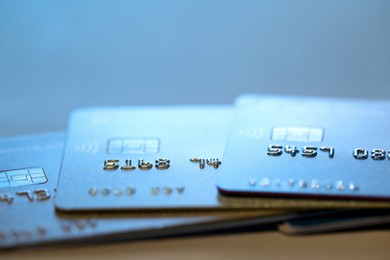 Many credit cards against blurred background, closeup