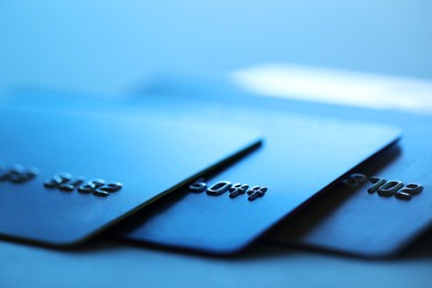 Many credit cards on blurred background, closeup