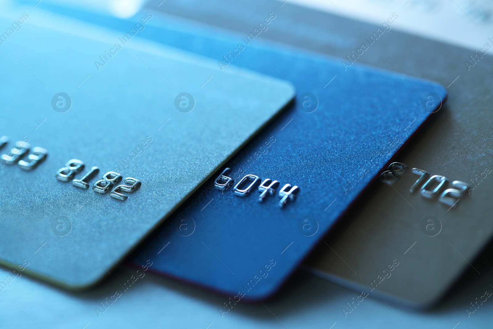 Photo of Many credit cards on table, closeup view