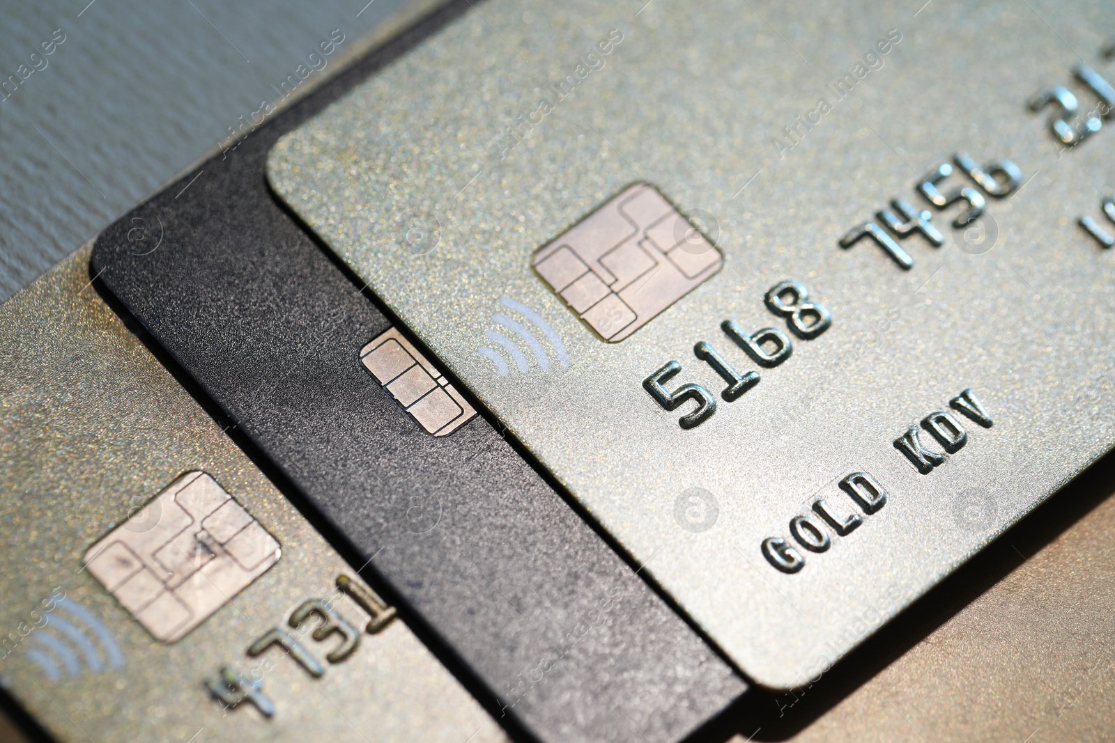 Photo of Many credit cards on gray background, closeup