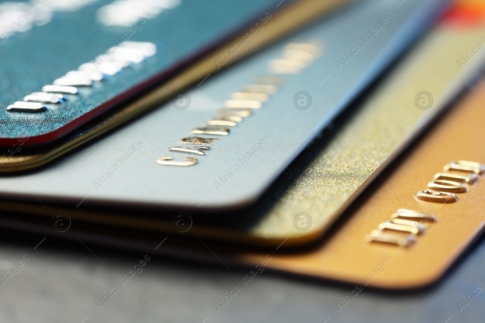 Photo of Many credit cards on table, closeup view