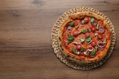 Photo of Delicious pizza with salami, vegetables, mushrooms and basil on wooden table, top view. Space for text