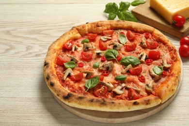 Photo of Delicious pizza with tomatoes, mushrooms and basil on wooden table, closeup