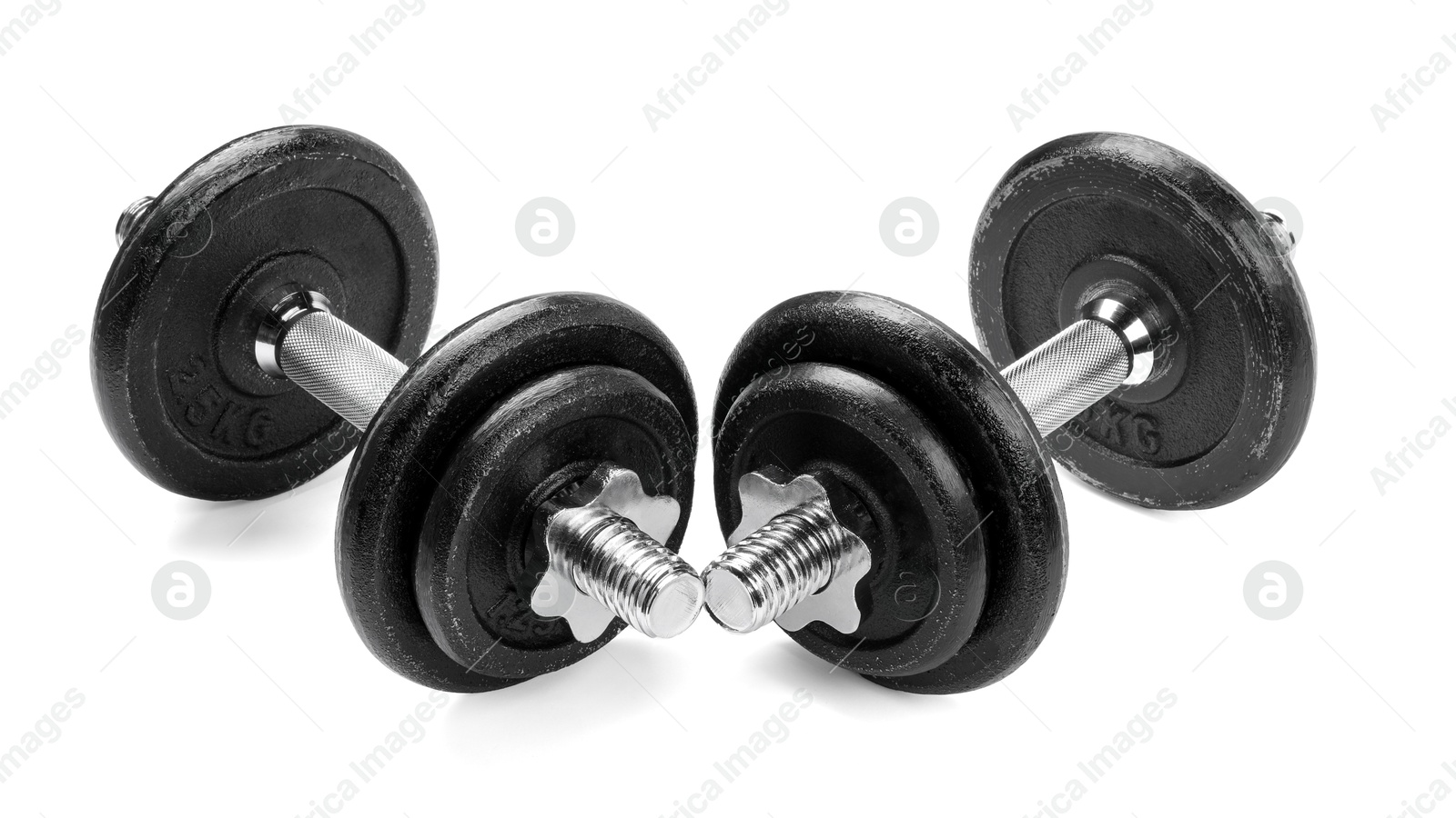 Photo of Metal dumbbells isolated on white. Sports equipment