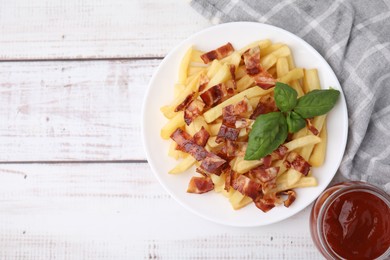 Photo of Delicious French fries with bacon, basil and ketchup on wooden rustic table, flat lay. Space for text