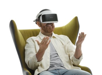 Photo of Man using virtual reality headset while sitting in armchair on white background
