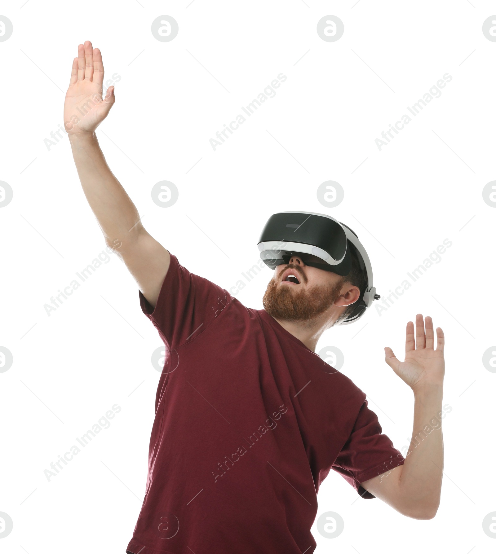 Photo of Emotional man using virtual reality headset on white background