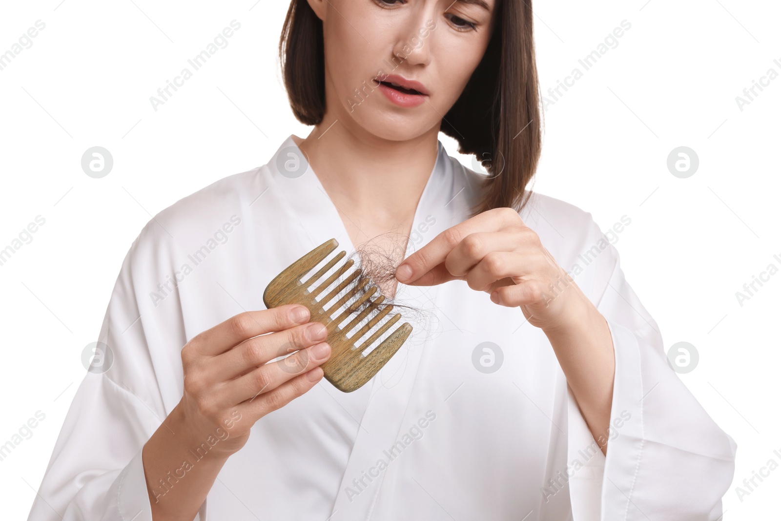 Photo of Woman taking her lost hair from comb on white background, closeup. Alopecia problem